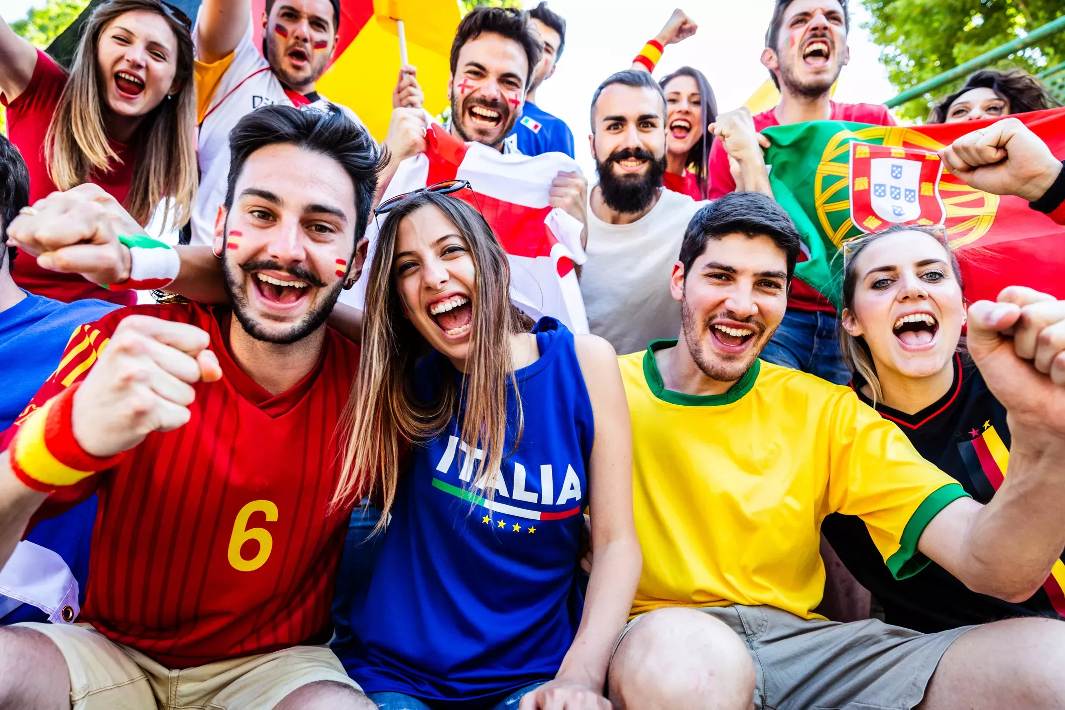 Multi-ethnic FIFA fans cheer together